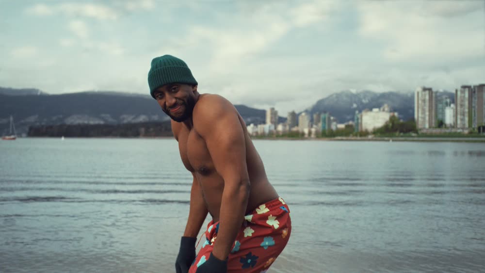 A man about to take a cold ocean plunge